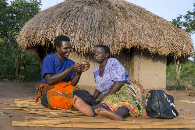 Community mobilizer and woman in Ayala ,Uganda