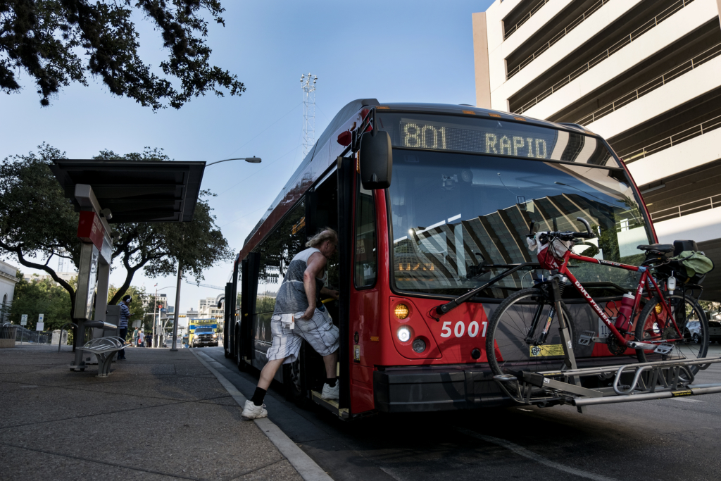 A passenger boards a Capital Metro bus. (Credit: Laura Skelding)
